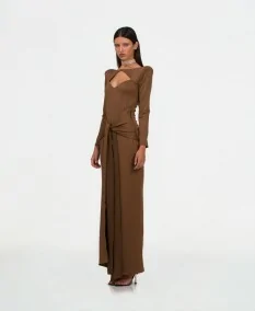 Long brown dress with opening on chest and bow on abdomen, side view