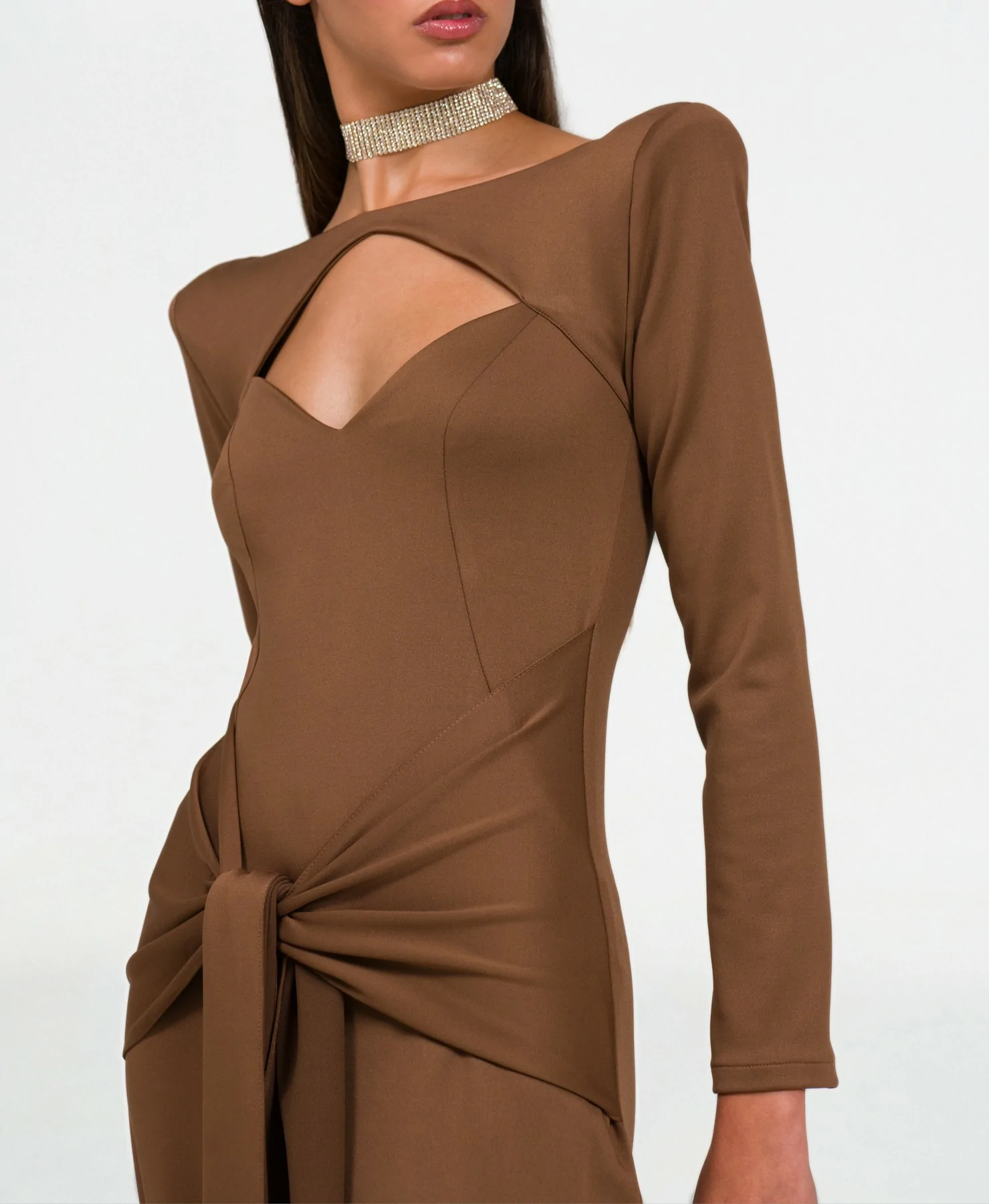 Long brown dress with opening in the chest and shoulder pads