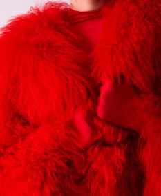 Women's fur coat in the color trend season: red