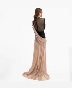 Fluid movement of the Arethusa dress at a rear angle.