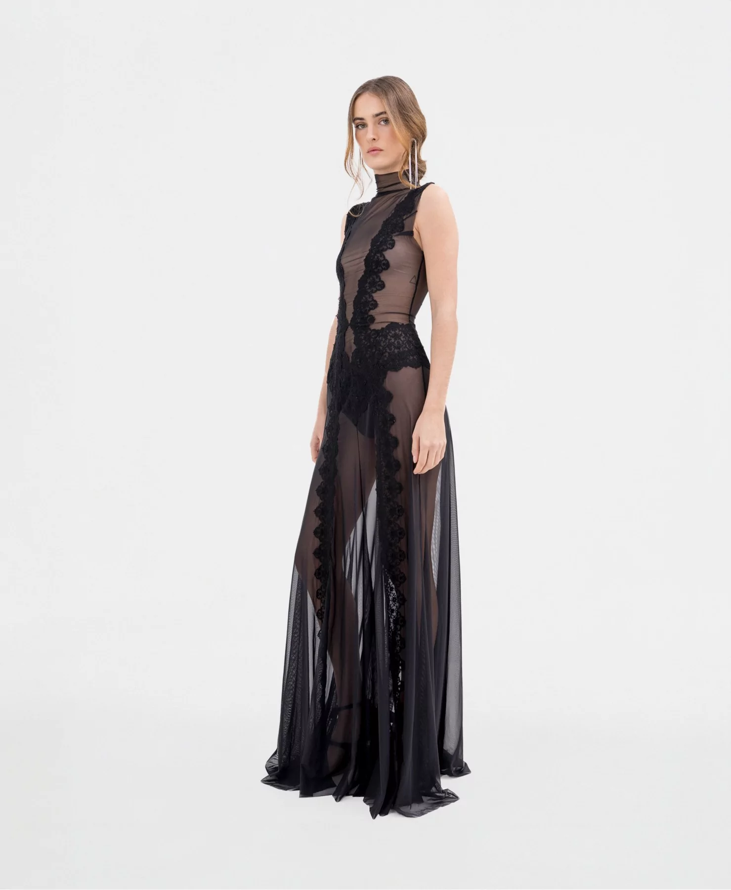 Elegance in black lace and transparencies in the Hecate Black Dress.